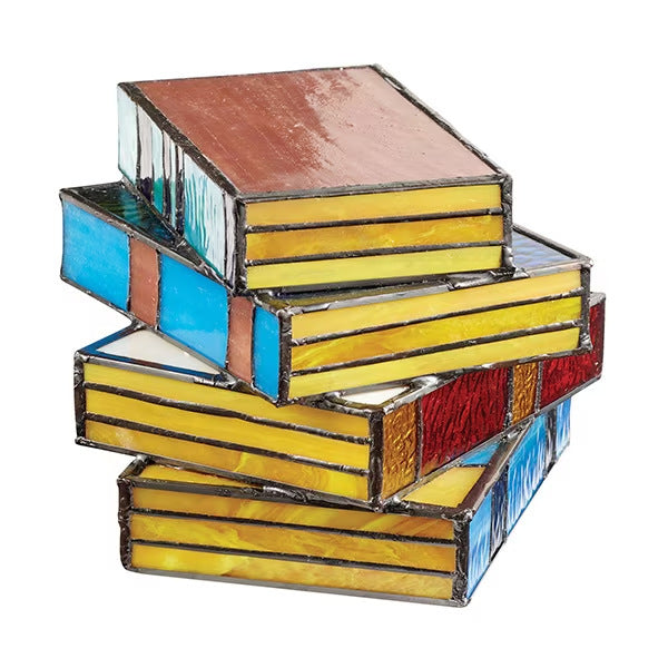 Junips | Desk lamp with stacked books