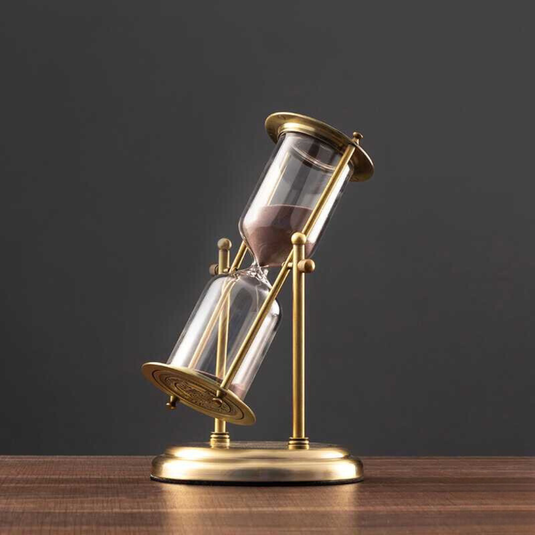 Junips | Antique hourglass made of brass with violet sand