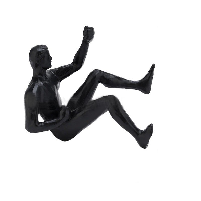 Junips | Climbing wall hanging statues