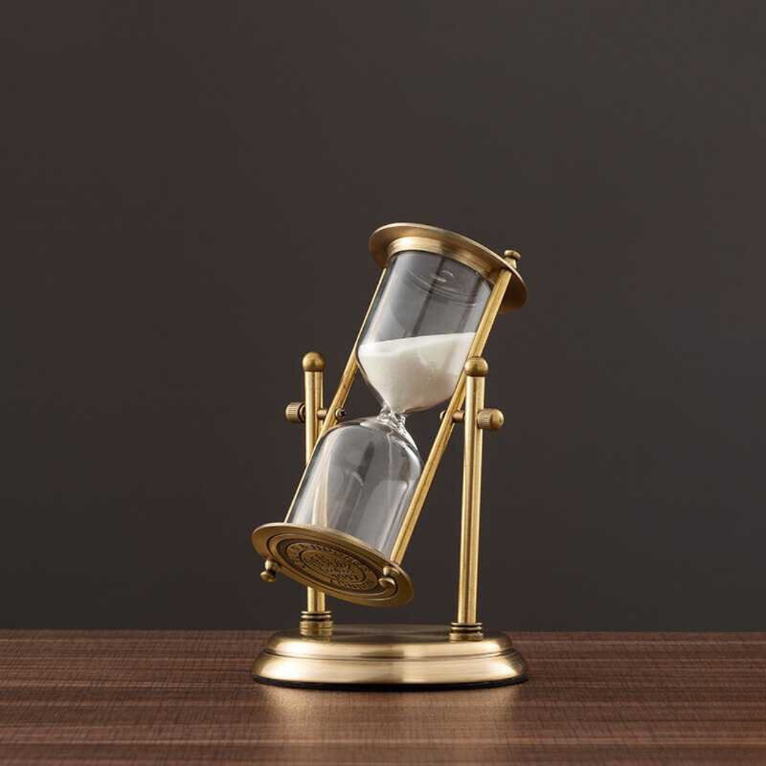 Junips | Antique hourglass made of brass with violet sand