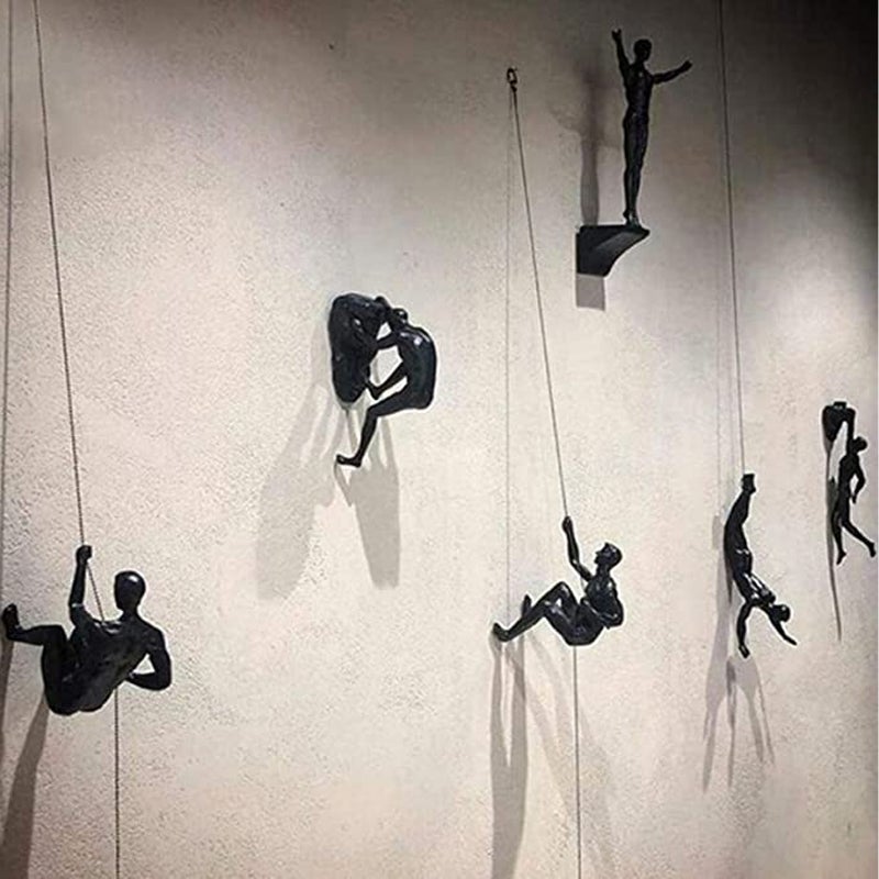 Junips | Climbing wall hanging statues