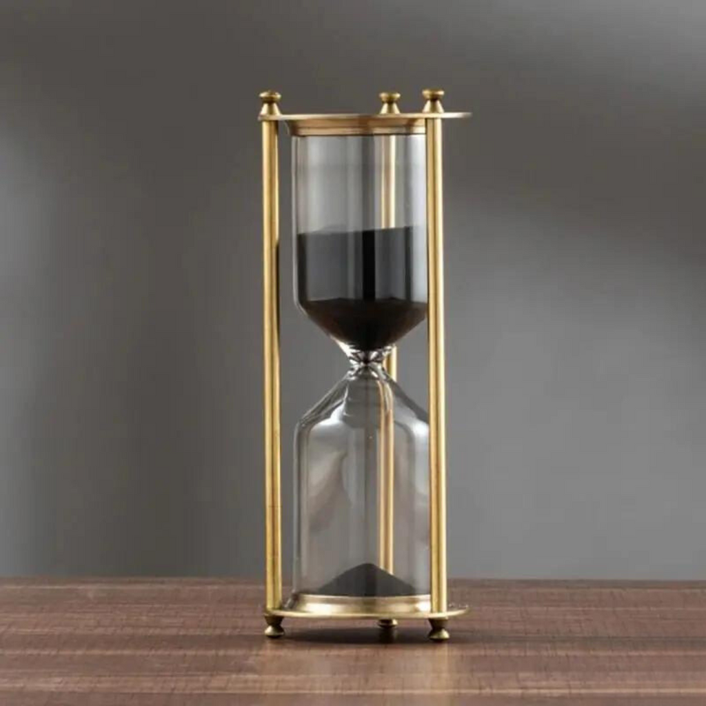 Junips | Antique hourglass made of brass with violet sand