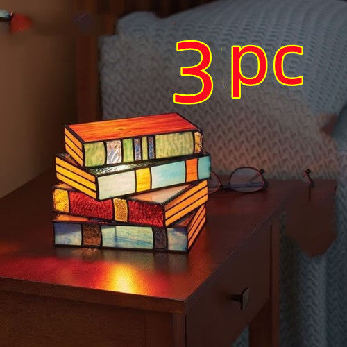 Junips | Desk lamp with stacked books