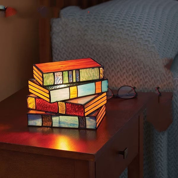 Junips | Desk lamp with stacked books
