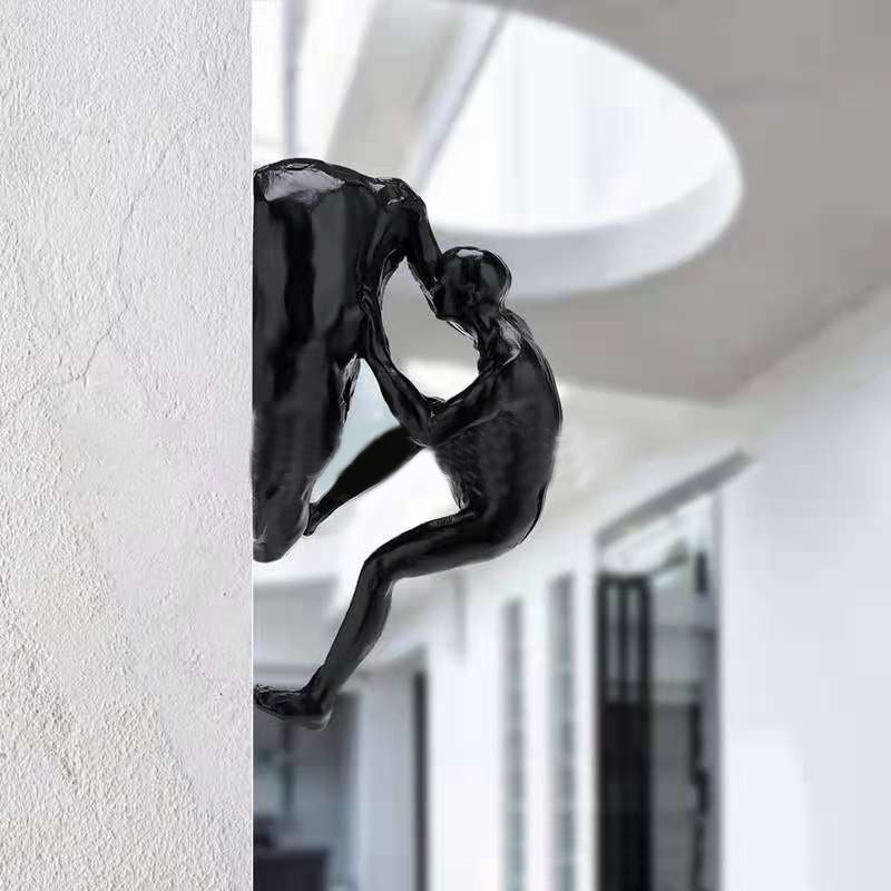 Junips | Climbing wall hanging statues