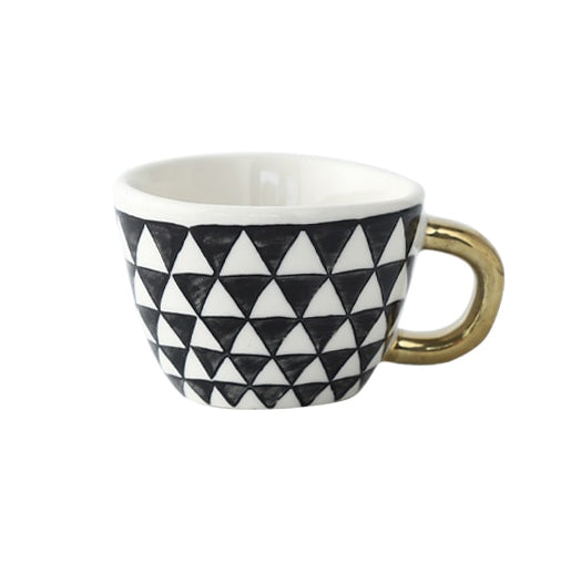 Junips | Cup with abstract geometric pattern and gold handle