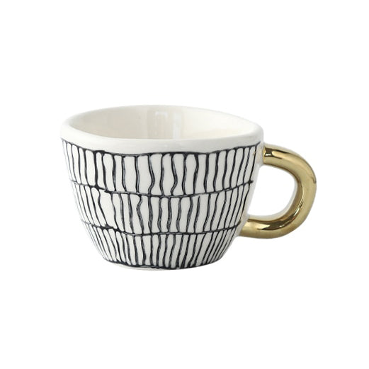 Junips | Cup with abstract geometric pattern and gold handle