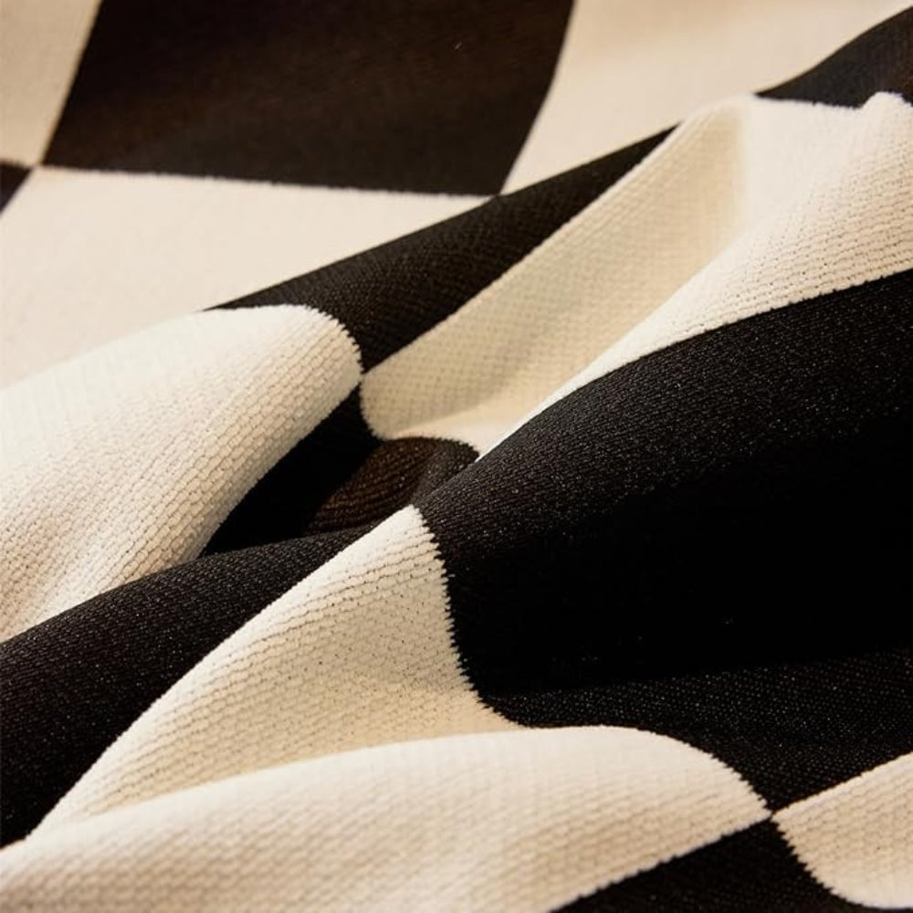 Junips | Chess Board Chic Tasseled Sofa Cover