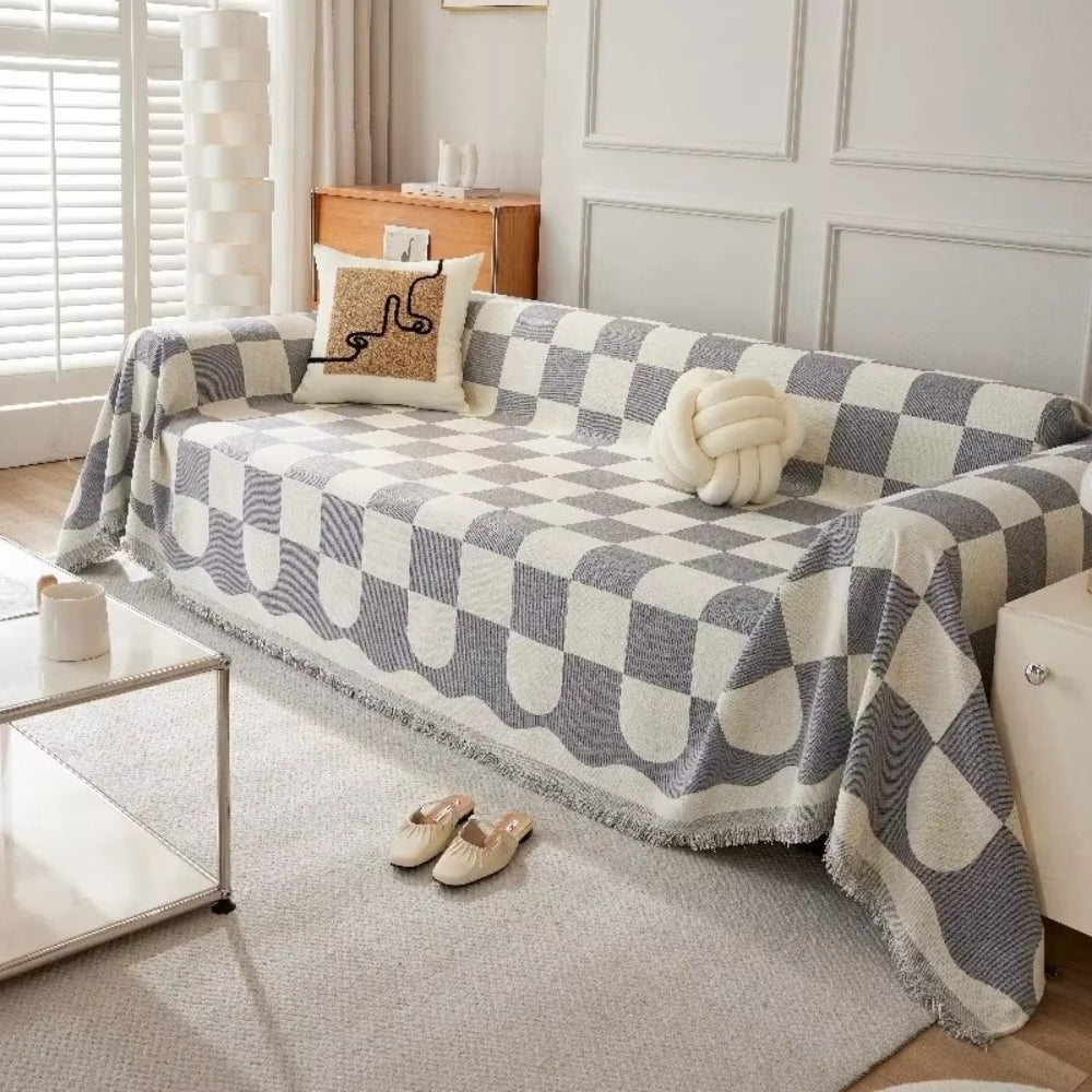 Junips | Chess Board Chic Tasseled Sofa Cover