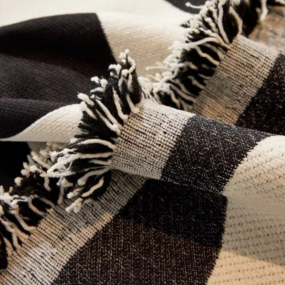 Junips | Chess Board Chic Tasseled Sofa Cover