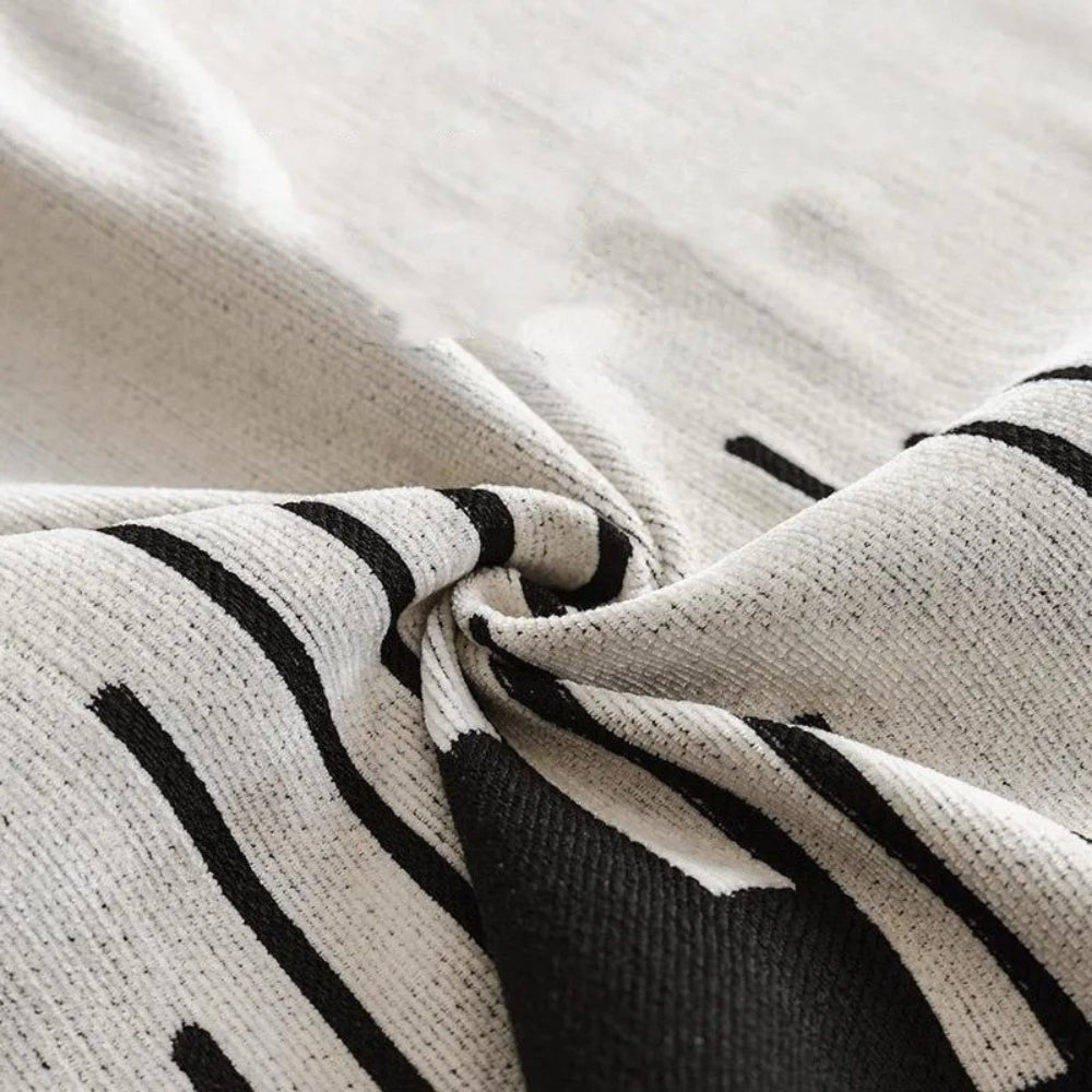 Junips | Elegant Black and White Sofa Cover Protector