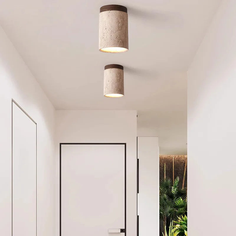 Junips | Built-in lustre made of travertine for entrance area and staircase