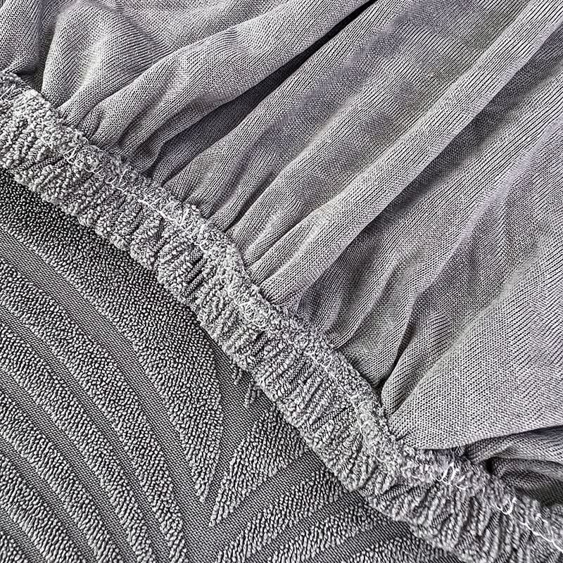 Junips | PlushSecure - Elegant Jacquard Sofa Cover for Non-Slip Comfort