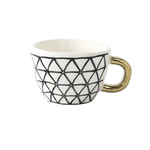 Junips | Cup with abstract geometric pattern and gold handle
