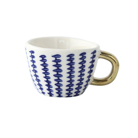 Junips | Cup with abstract geometric pattern and gold handle