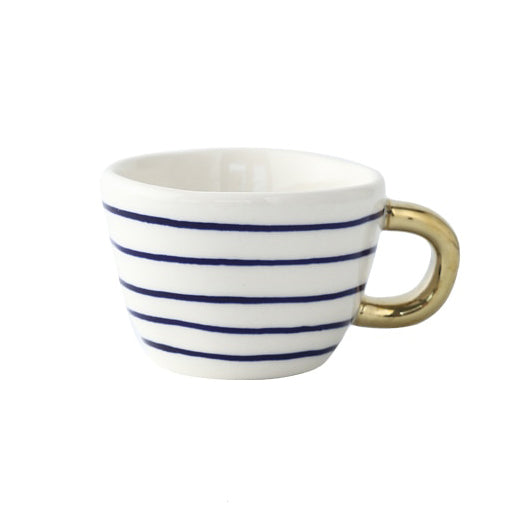 Junips | Cup with abstract geometric pattern and gold handle