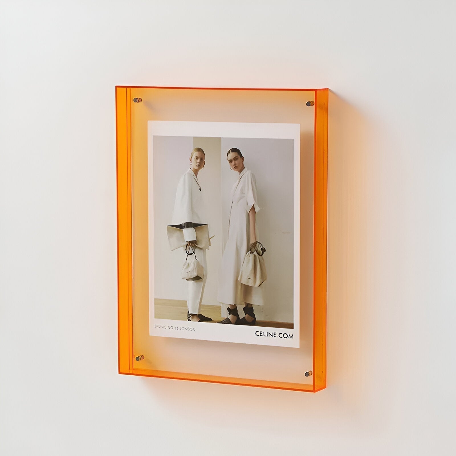 Junips | Colored transparent acrylic frame for modern displays