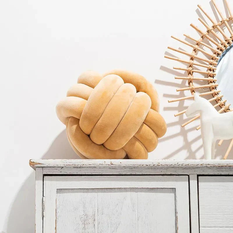 Junips | Decorative, soft cushion with knotted ball in suede look