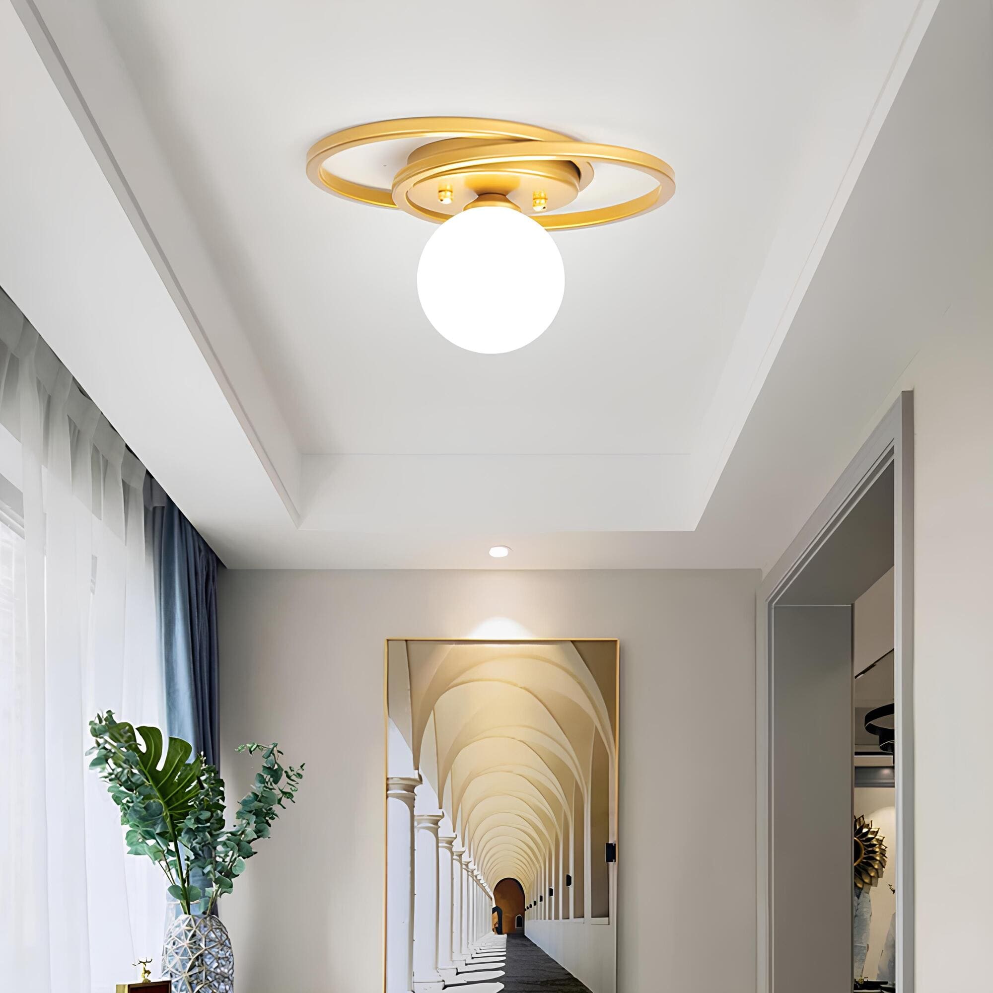 Junips | LumiNoble | Timeless ceiling light with golden LED ball design