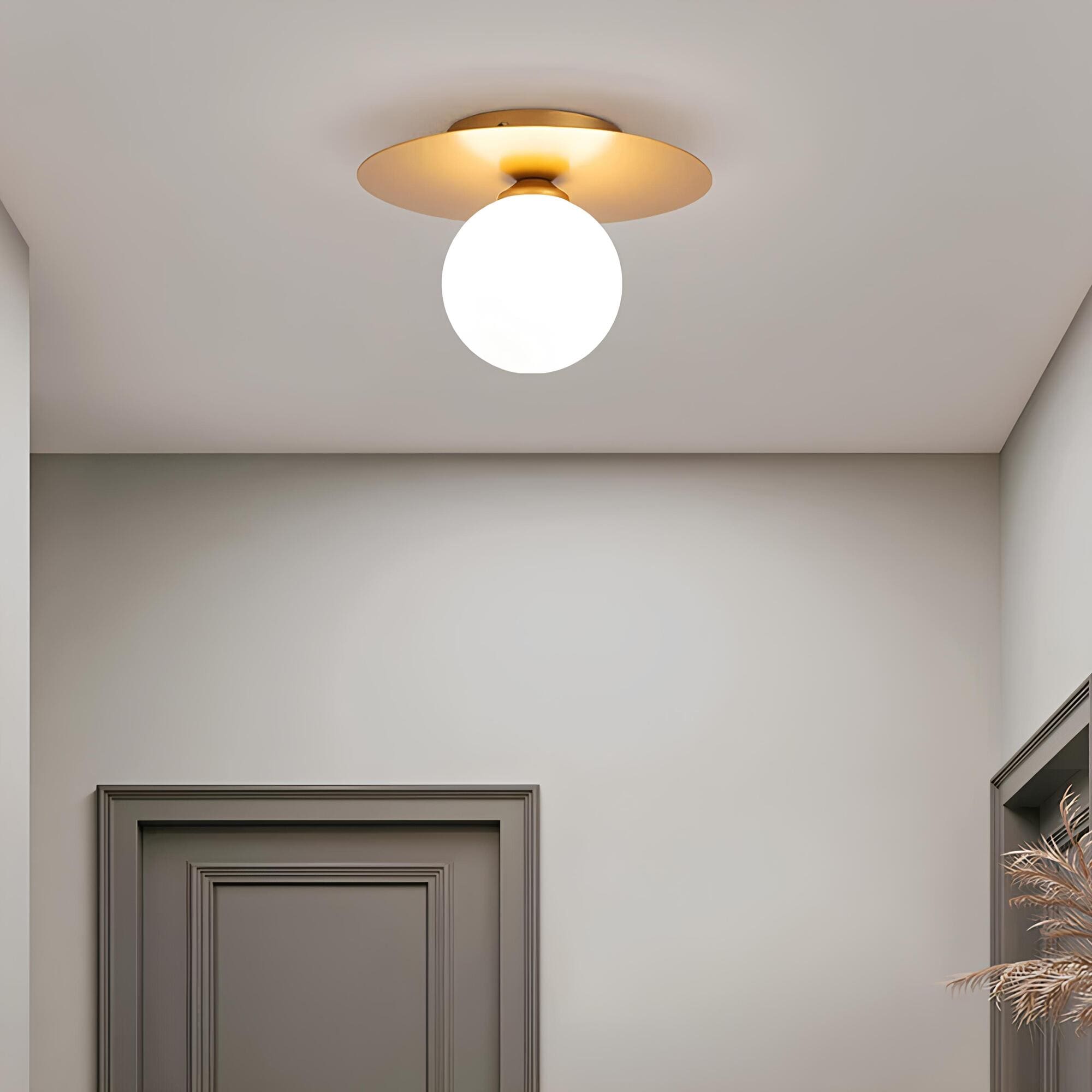 Junips | LumiNoble | Timeless ceiling light with golden LED ball design