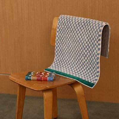 Junips | Soft, fluffy bathroom rug with check pattern